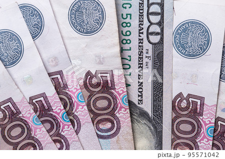Ruble Russian currency and dollar close-up. Exchange rate. The dollar to ruble exchange rate 95571042