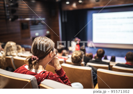 Woman giving presentation on business conference event. Woman giving presentation on business conference event. 95571302