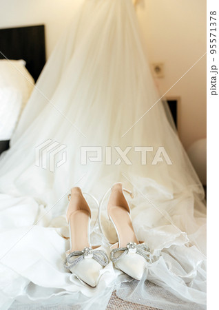 white wedding dress and shoes with accessories 95571378