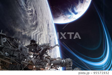 Orbital space station on background of deep space planets 95571932