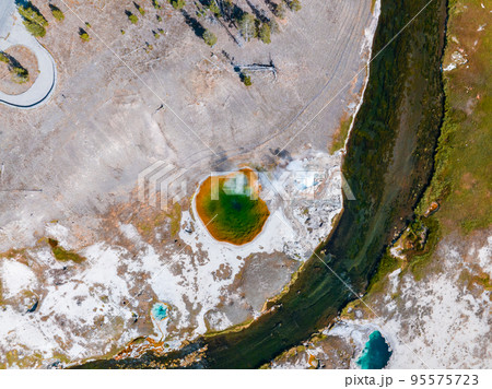 Beautiful geysers with hot water and steam with pools of thermophilic bacteria in the Upper Geyser Basin of Yellowstone National Park, Wyoming, United States. Beautiful geysers with hot water and steam with pools of thermophilic bacteria in the Upper Geyser Basin of Yellowstone National Park, Wyoming, United States. 95575723