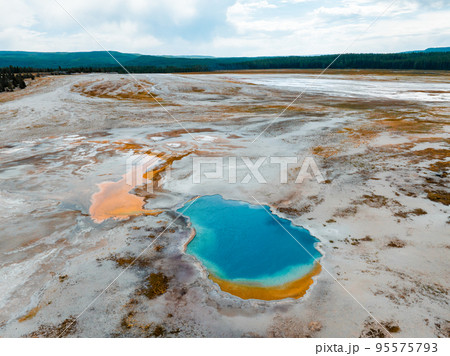 Beautiful geysers with hot water and steam with pools of thermophilic bacteria in the Upper Geyser Basin of Yellowstone National Park, Wyoming, United States. 95575793