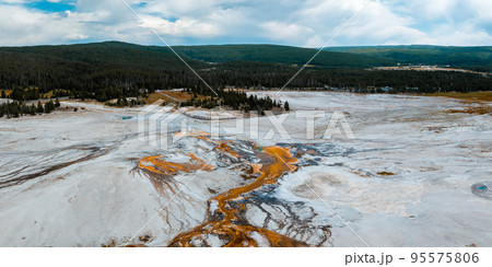 Beautiful geysers with hot water and steam with pools of thermophilic bacteria in the Upper Geyser Basin of Yellowstone National Park, Wyoming, United States. Beautiful geysers with hot water and steam with pools of thermophilic bacteria in the Upper Geyser Basin of Yellowstone National Park, Wyoming, United States. 95575806
