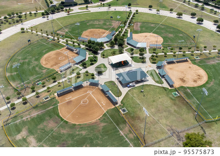 Aerial view a large baseball stadiums in the summertime Aerial view a large baseball stadiums in the summertime 95575873