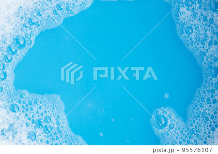 Detergent foam bubble, blue background. Detergent foam bubble, blue background. 95576107