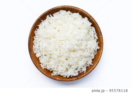 Wooden bowl of rice on white background. 95576118