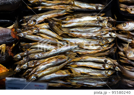 Cured herring and other fish in supermarket 95580240