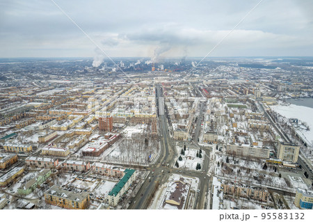 Winter view of the center of the city of Nizhny Tagil and the metallurgical plant from above. Environmental problem of environmental pollution and air in large cities Winter view of the center of the city of Nizhny Tagil and the metallurgical plant from above. Environmental problem of environmental pollution and air in large cities 95583132