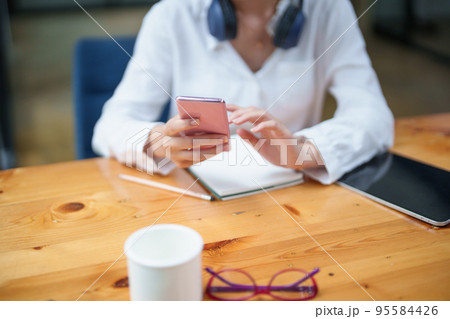 Portrait of a teenage girl using her phone to make video calls or call friends 95584426