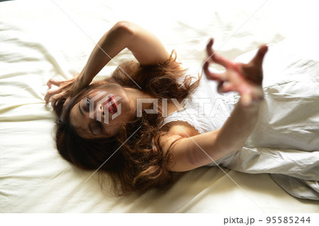 Happy Halloween day in Scary ghost woman. Asian ghost or zombie horror creepy scary have hair covering face and eye reach arm out at abandoned house dark room.  95585244