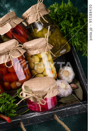 Pickled vegetables in glass jars. Pickled vegetables in glass jars. 95588430