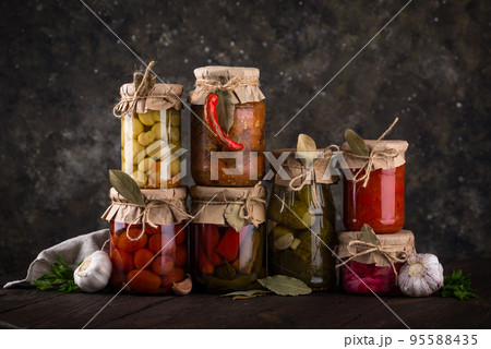 Pickled vegetables in glass jars. Pickled vegetables in glass jars. 95588435