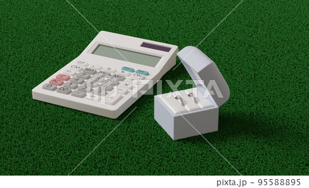 平面上に置かれた2つの結婚指輪を収めたケースと白い電卓の3Dレンダリングイラスト 95588895