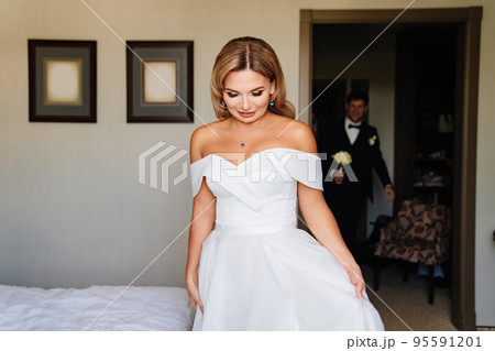first meeting. gentle and in love blonde bride and groom in the room  95591201