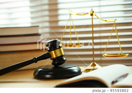 Lawyer or judge's hammer in the court. Auction's hammer and judgement golden scale are on wood table. Law subject. Judgement subject to judge people. Lawyer or judge's hammer in the court. Auction's hammer and judgement golden scale are on wood table. Law subject. Judgement subject to judge people. 95593802