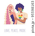 Lesbians hug. dark and white women are smiling happily. Rainbow LGBT flag on the T-shirt. LOve. peace. pride 95598163