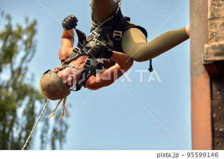 Special forces soldier with weapon take part in military maneuver. War, army, technology and people concept Special forces soldier with weapon take part in military maneuver. War, army, technology and people concept 95599146
