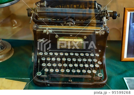 Exhibition of an old black typewriter, close-up photo. Exhibition of an old black typewriter, close-up photo. 95599268