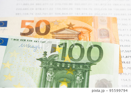 Euro banknotes on spreadsheet paper, Banking Account, Investment Analytic research data economy, trading, Business company concept. Euro banknotes on spreadsheet paper, Banking Account, Investment Analytic research data economy, trading, Business company concept. 95599794