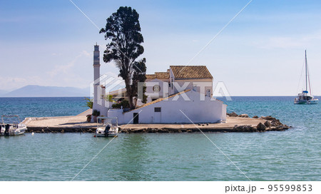 Old stone white monastery Vlacherna on the island. Corfu. Old stone white monastery Vlacherna on the island. Corfu. 95599853