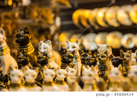 Souvenir in the form of a cat in the old bazaar of Egypt close-up. 95600414