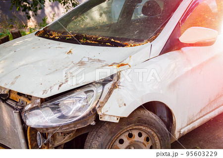 Car after traffic accident. Crashed car. Accident on road. Insurance payments. 95603229