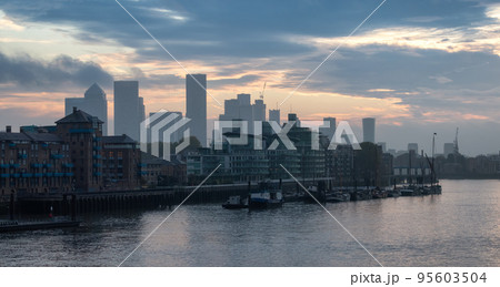 View of River Thames and City Skyline during dramatic sunrise. City of London 95603504