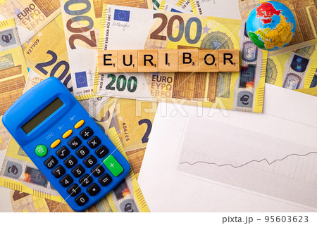 Word EURIBOR Is Written In Wooden Letters On Background Of 200 Euro Banknotes, Globe, Calculator And Chart. Copy paste. 95603623