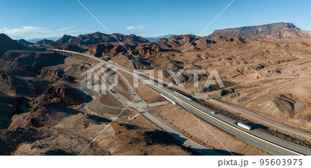 Aerial view of highway in California, United States. Scenic landscape, road, desert. Driving truck, car. Traveling. View from above, drone shot. 95603975