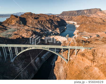 Aerial view of the Hoover Dam in United States. Aerial view of Hoover Dam and the Colorado River Bridge Aerial view of the Hoover Dam in United States. Aerial view of Hoover Dam and the Colorado River Bridge 95604029