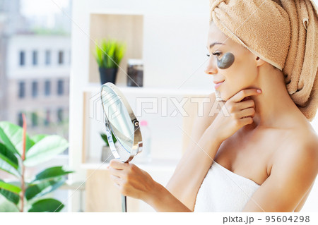 Woman face black patches posing close up Lifestyle 95604298