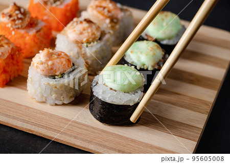 Sushi set on bamboo tray Stock Photo by Rido81