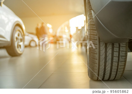 Brand new cars at the dealer showroom Brand new cars at the dealer showroom 95605862