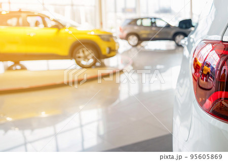 Brand new cars at the dealer showroom Brand new cars at the dealer showroom 95605869