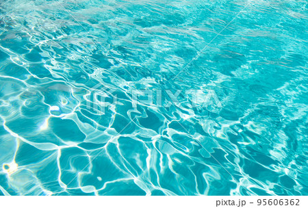 blue color background of swimming pool water with ripples in summer blue color background of swimming pool water with ripples in summer 95606362