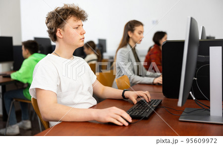 Interested teenage student during lesson in computer class 95609972