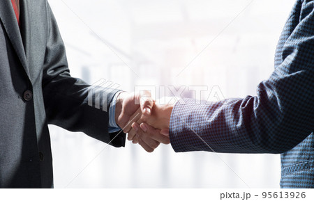 Close-up of the handshake of businessmen. Close-up of the handshake of businessmen. 95613926