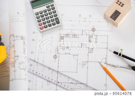 Top view of house plan blueprint paper with repair tools on table desk at architecture office 95614078