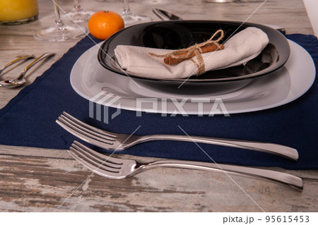Rustic table setting with pink flowers and candle on light wooden table. Holidays decoration on Provence style. Romantic dinner. Overhead 95615453