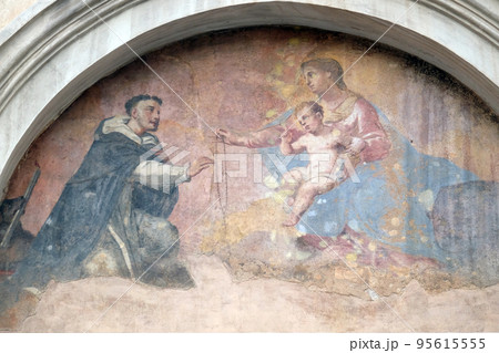 Fresco of Our Lady with Child Jesus and Saint Dominic, tympani over the side entrance of Basilica Santa Maria Sopra Minerva, Rome, Italy Fresco of Our Lady with Child Jesus and Saint Dominic, tympani over the side entrance of Basilica Santa Maria Sopra Minerva, Rome, Italy 95615555