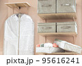 Organizing home storage. Organization of home space. Storage of things in the dressing room on the shelves in textile baskets and boxes 95616241