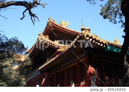 Tiled roof and facade decorated with a Chinese pattern. Palace in The Forbidden City, Beijing Tiled roof and facade decorated with a Chinese pattern. Palace in The Forbidden City, Beijing 95616950