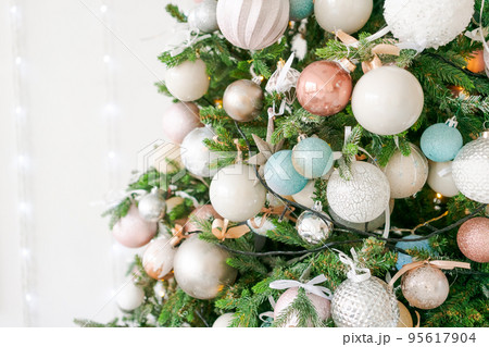 Beautiful festive decorated room with Christmas tree and bright fire 95617904