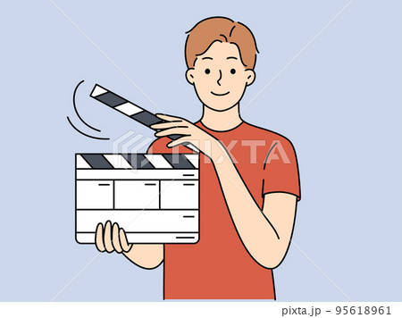 Smiling man with film flapper 95618961