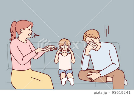 Unhappy child crying with parents fighting  95619241