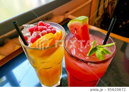 Delicious and cold cocktails in the cafe on a hot day. Summer mood. 95620672