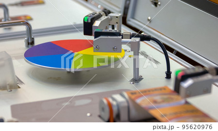 Polygraphy printing concept. Rotating wheel palette. Working machinery equipment. Polygraphy printing concept. Rotating wheel palette. Working machinery equipment. 95620976