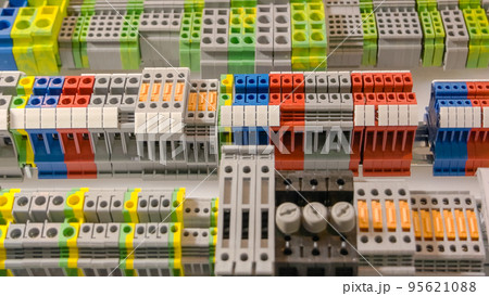 Close-up large electrical terminal block machine panel. Quick connect and release terminal connector. Close-up large electrical terminal block machine panel. Quick connect and release terminal connector. 95621088