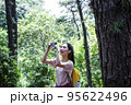 korean young woman hiking and plogging__taking photo 95622496