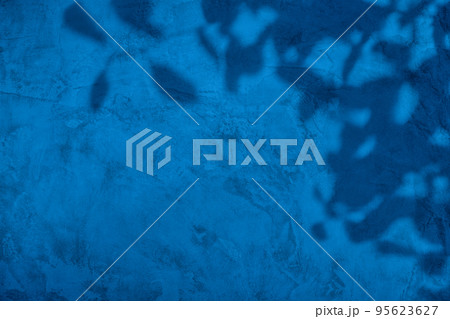 Shadow of leaves on blue concrete wall texture background Shadow of leaves on blue concrete wall texture background 95623627